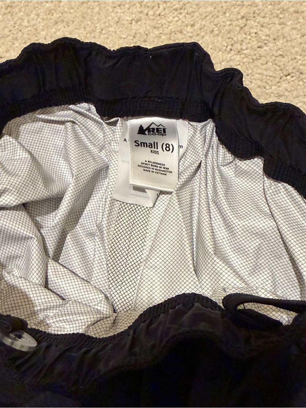 REI Kids Black Waterproof rain pants with Reflective Trim - Picture 2 of 3
